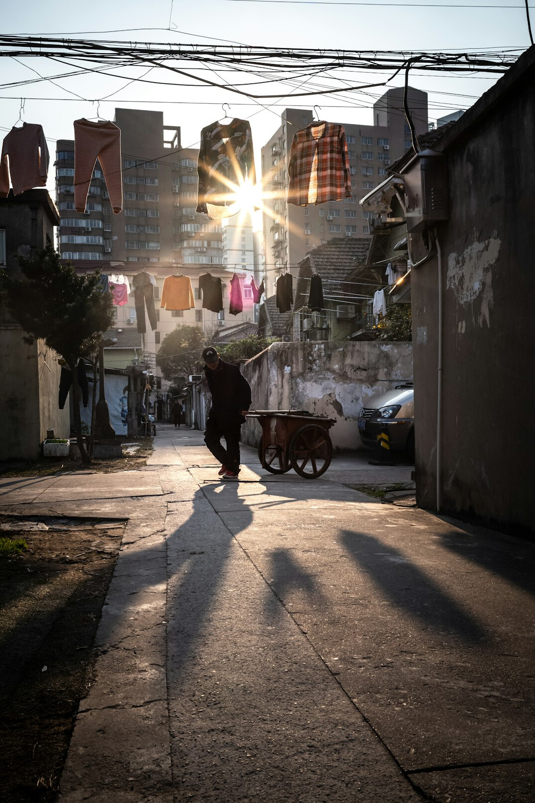 Street photography of people walking through a sunlit Latin American city street
