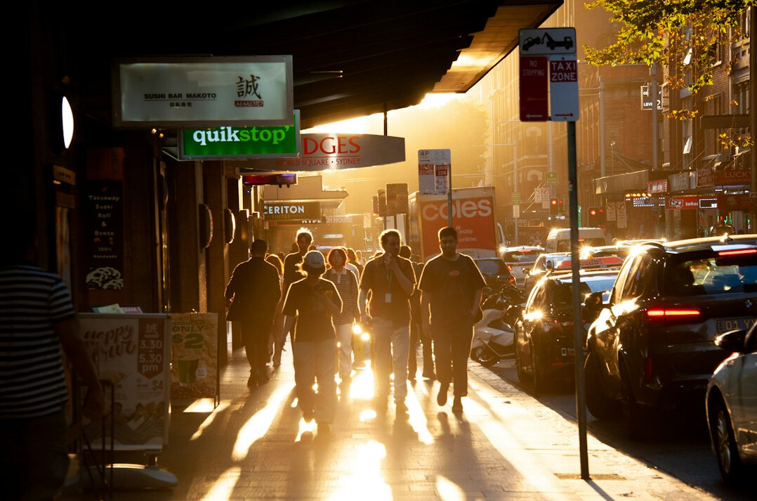 people walking in busy street