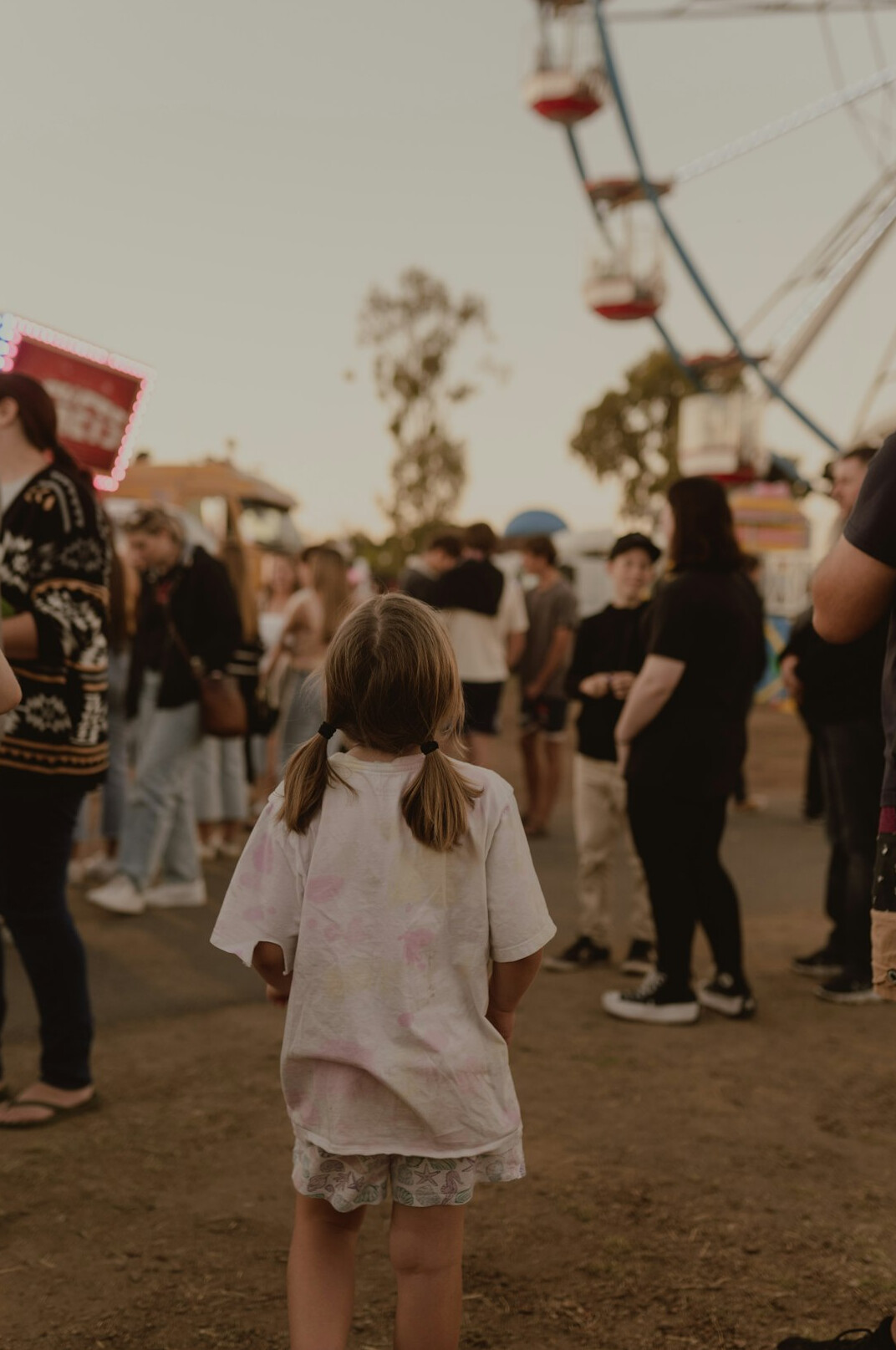 child at fair with parent