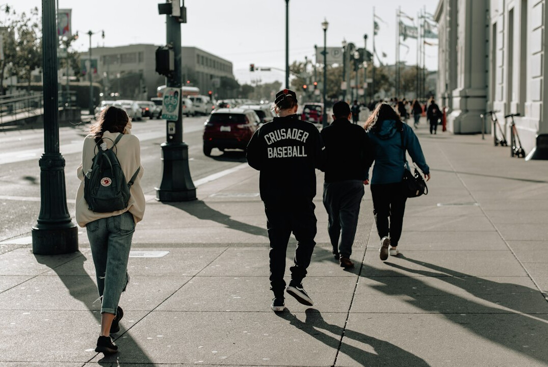 person walking on city street