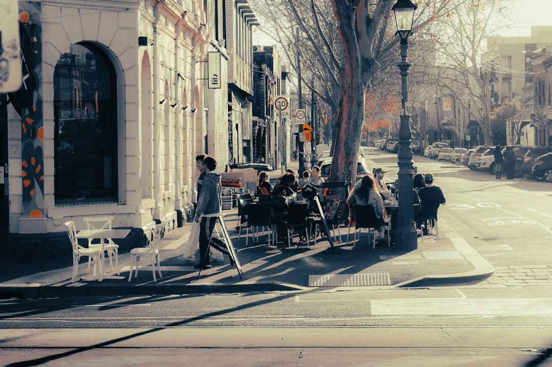 people chatting on street corner