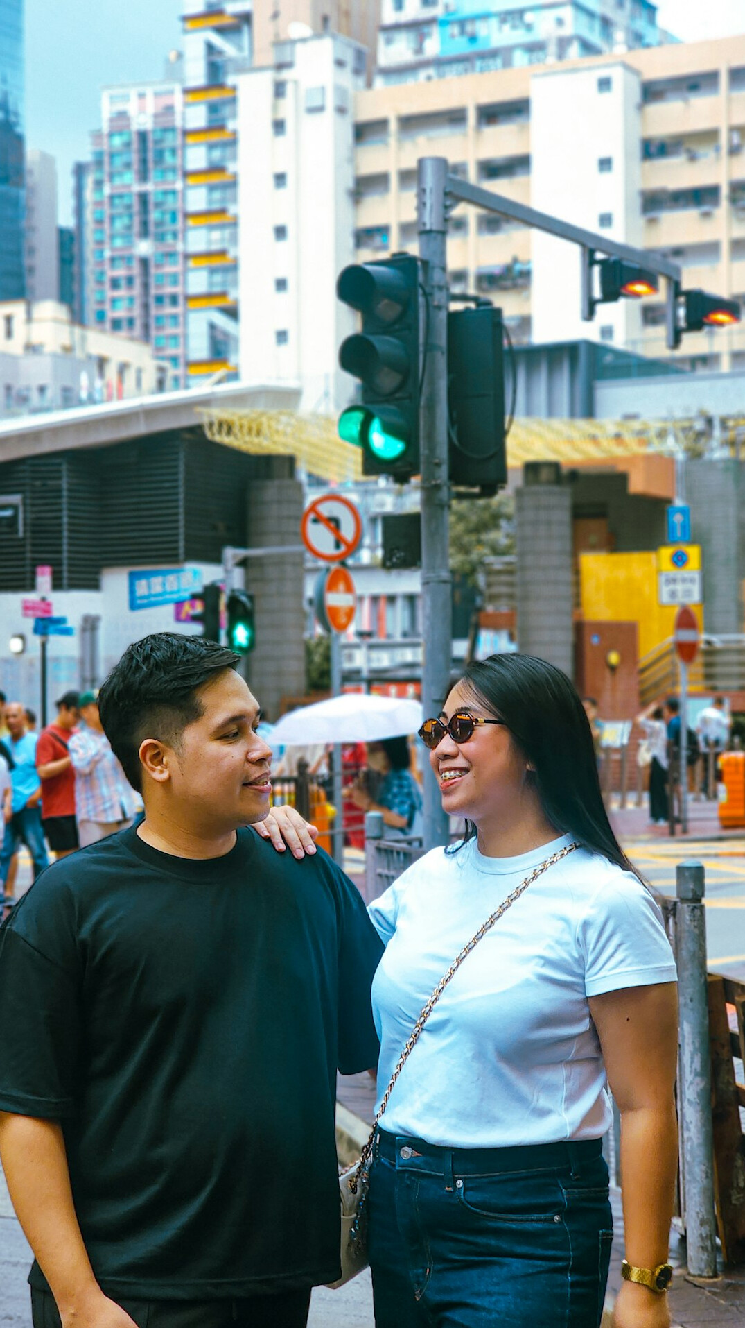 couple smiling at traffic light